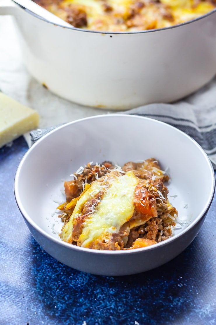 Serving of One Pot Lasagne in a bowl on a blue background