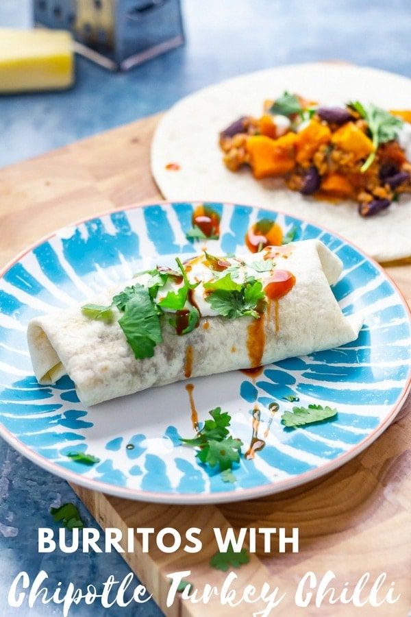 These burritos are stuffed with the most amazing cheesy chipotle turkey chilli. Serve them with sour cream, hot sauce and some fresh coriander leaves for a dream Mexican dinner. #burritos #turkeychilli #thecookreport #mexicanfood