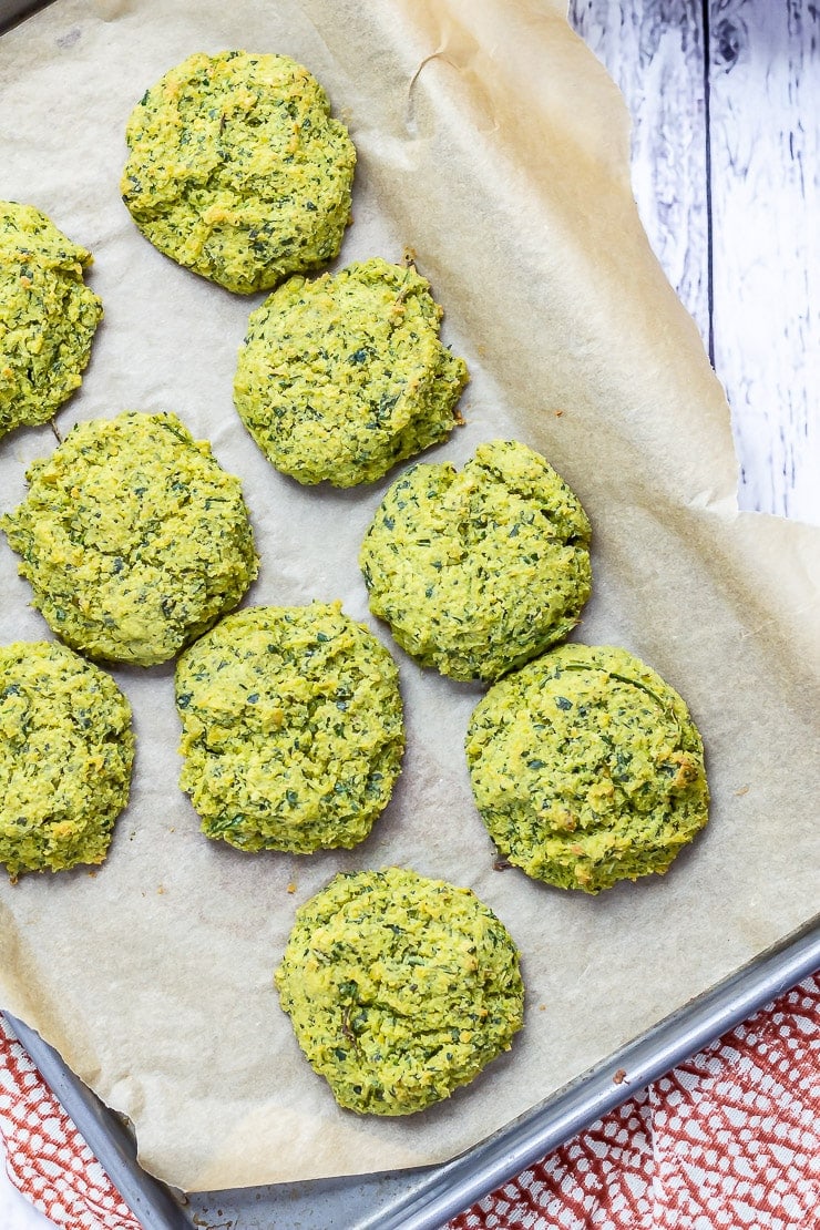 Overhead shot of baked falafel on a baking sheet