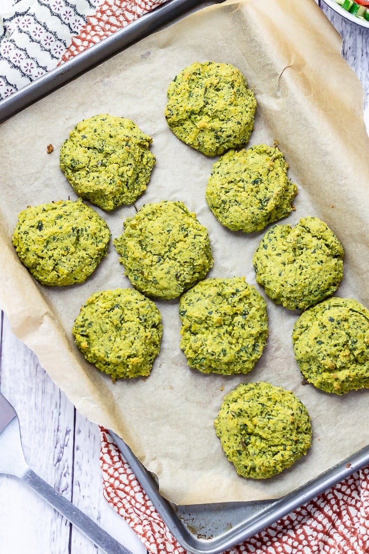 Overhead shot of baked falafel on a baking sheet