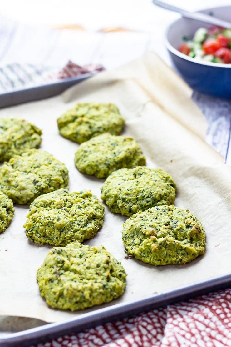 Baked falafel on a baking sheet on a patterned cloth