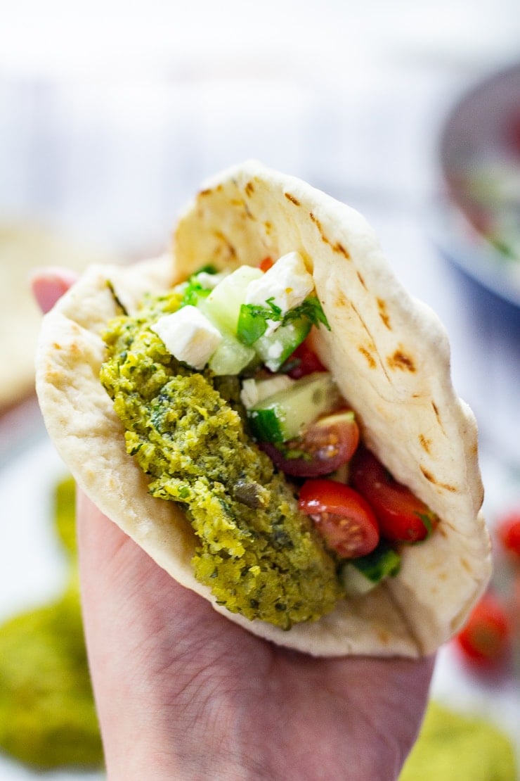 Baked falafel in a flatbread with cucumber, tomato and feta