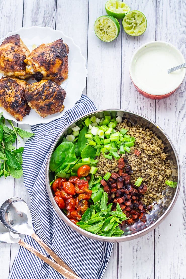 Overhead shot of chipotle chicken salad on a white wooden background