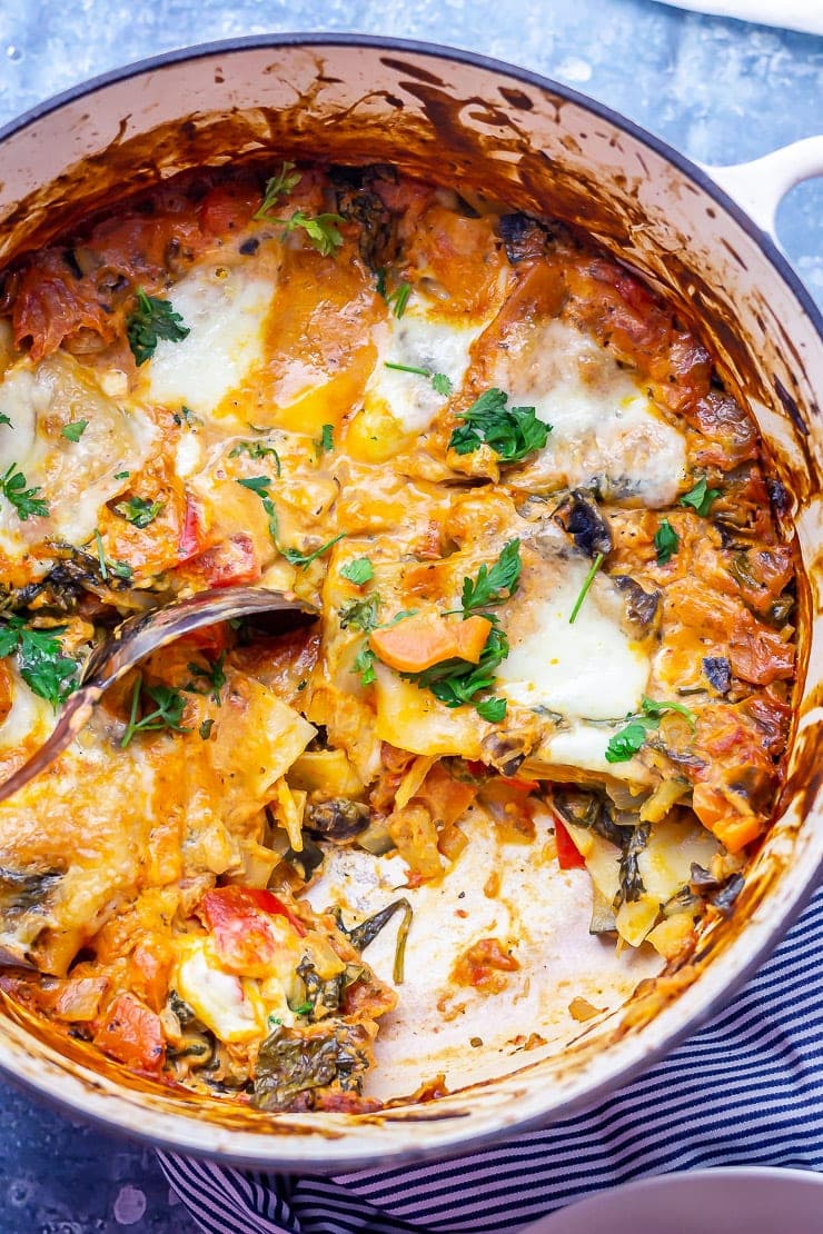 Overhead shot of one pot vegetarian lasagne with a piece taken