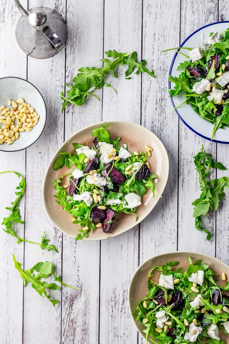 Overhead shot of beetroot salad on a white wooden background