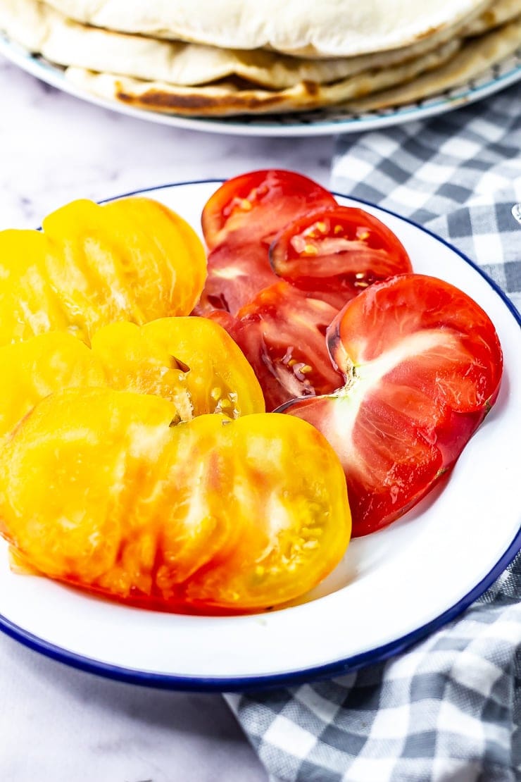 Tomatoes for mushroom wraps with a checked cloth