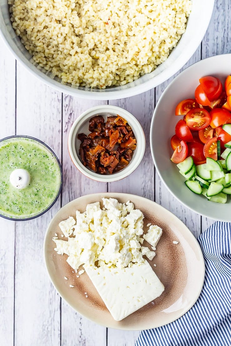 Overhead shot of summer salad with pearl barley ingredients