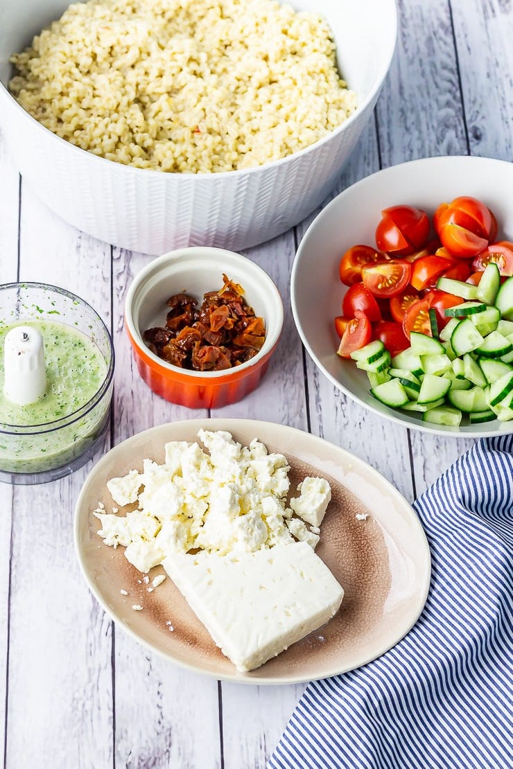 Ingredients for summer salad with pearl barley on a white wooden background