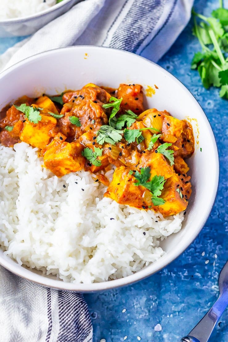 Paneer tikka masala in a bowl on a blue background