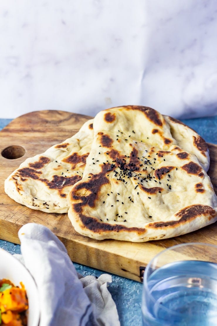 Photo of naan bread on a wooden board