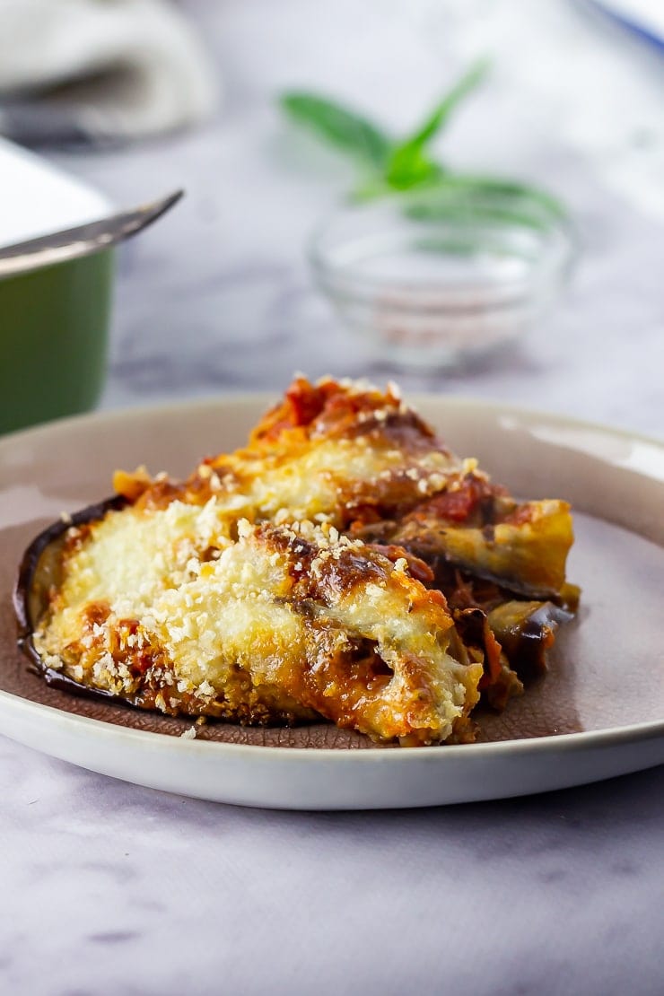 Portion of aubergine parmigiana on a plate