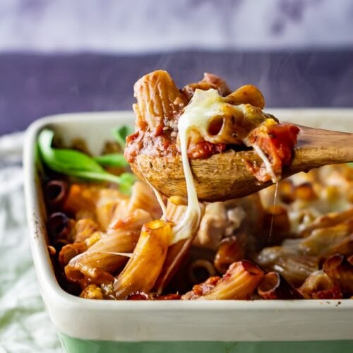One pot cheese and tomato pasta bake with a spoonful being taken
