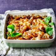 One pot cheese and tomato pasta bake with a spoonful being taken