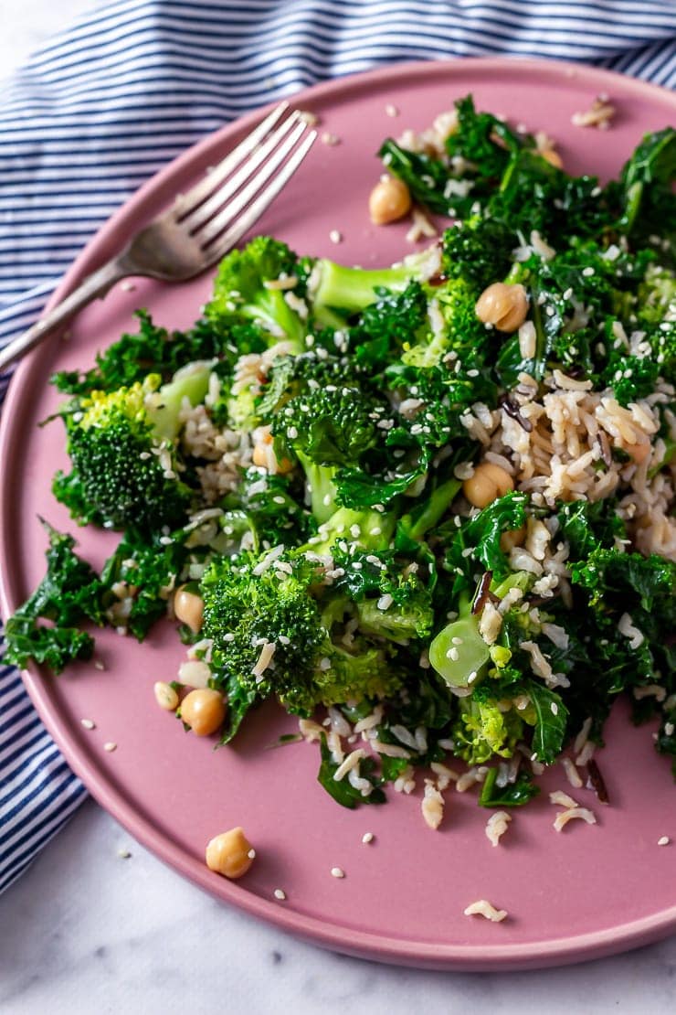 Close up of broccoli and wild rice salad on a pink plate