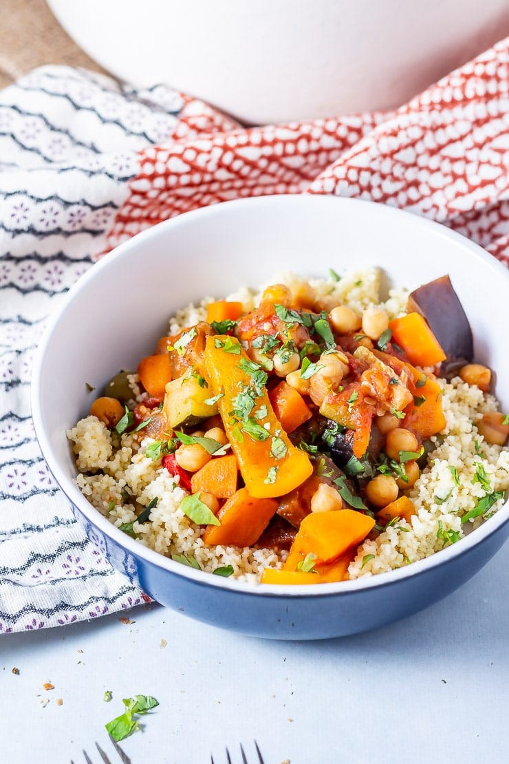 Side on shot of vegetable tagine in a blue bowl