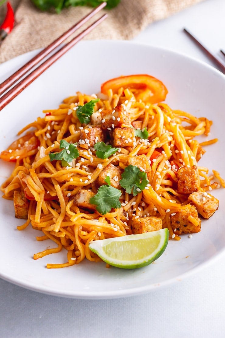 Spicy noodles with tofu in a white bowl