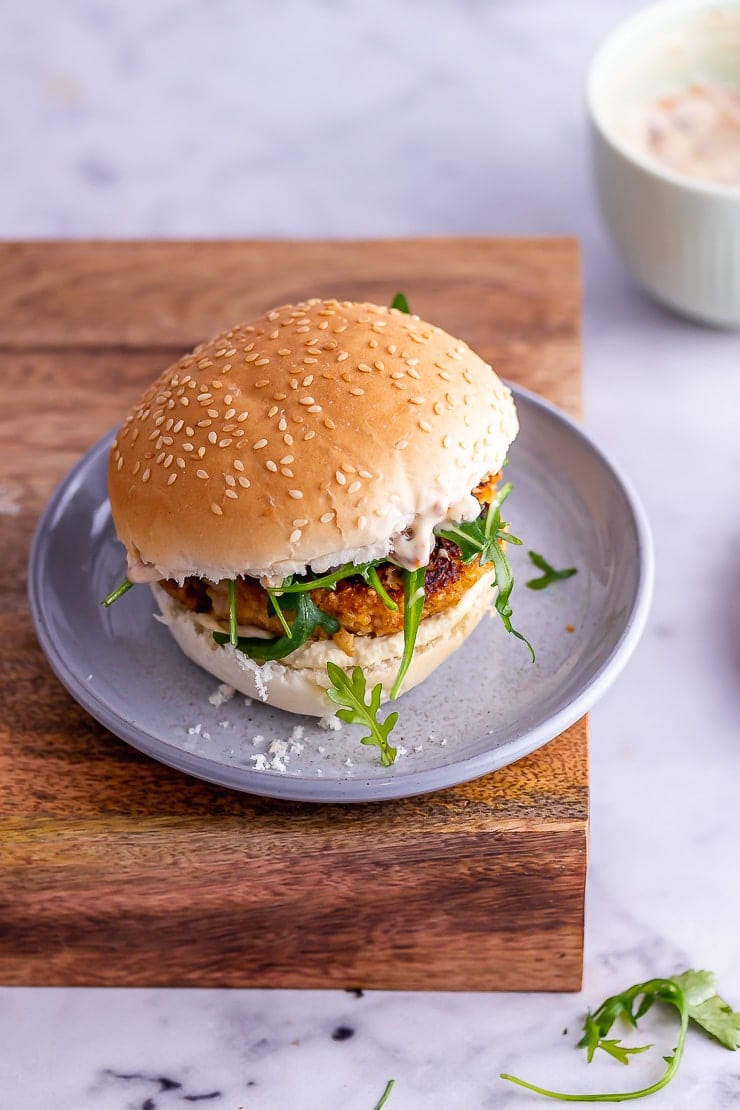 Veggie burgers on a grey plate on a wooden board