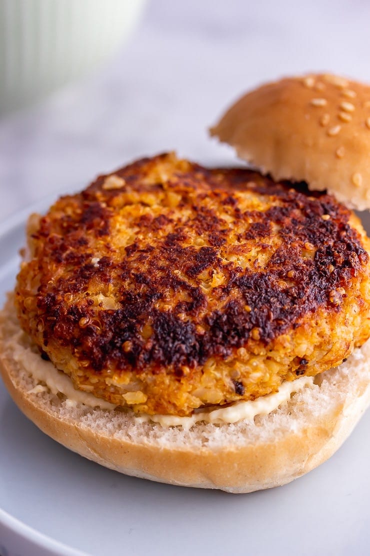 Veggie burgers on a plate without a top bun