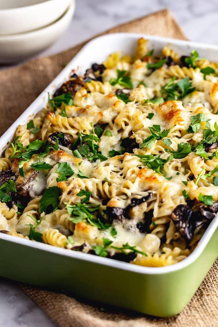 Green baking dish of creamy mushroom pasta 