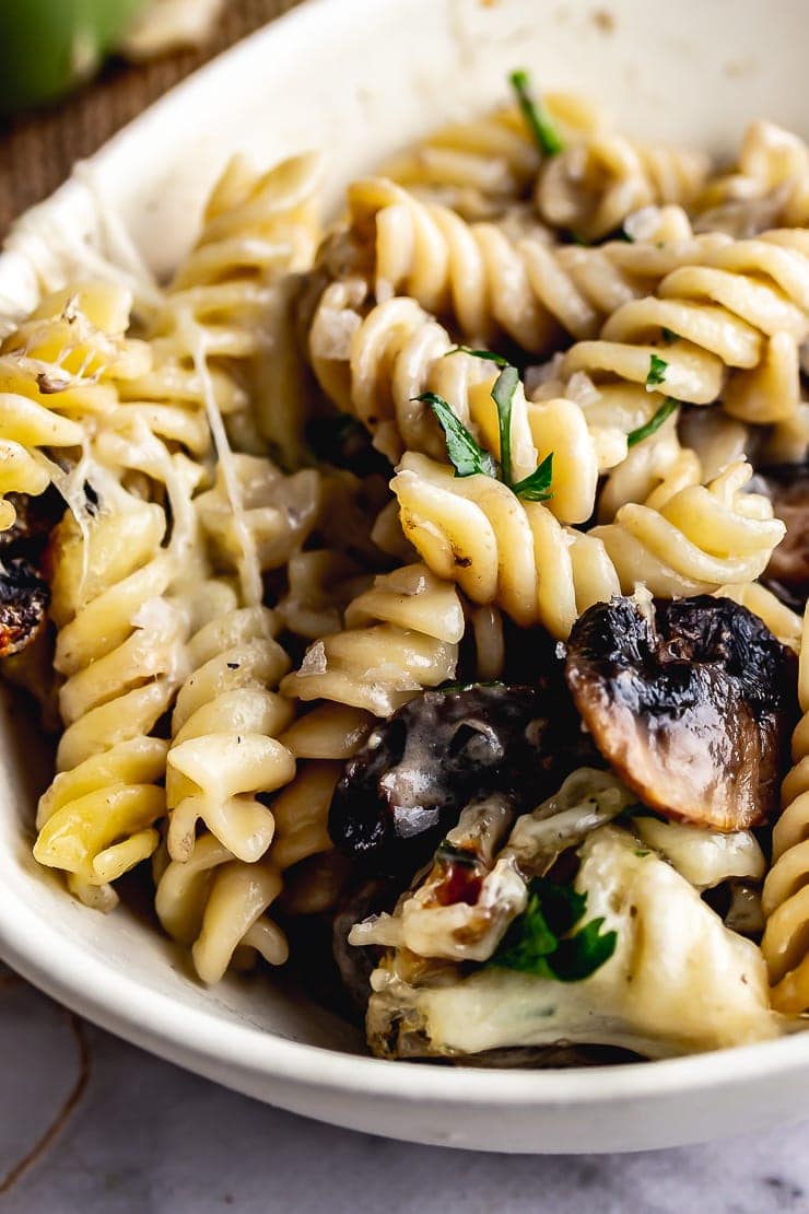 White bowl of creamy mushroom pasta bake