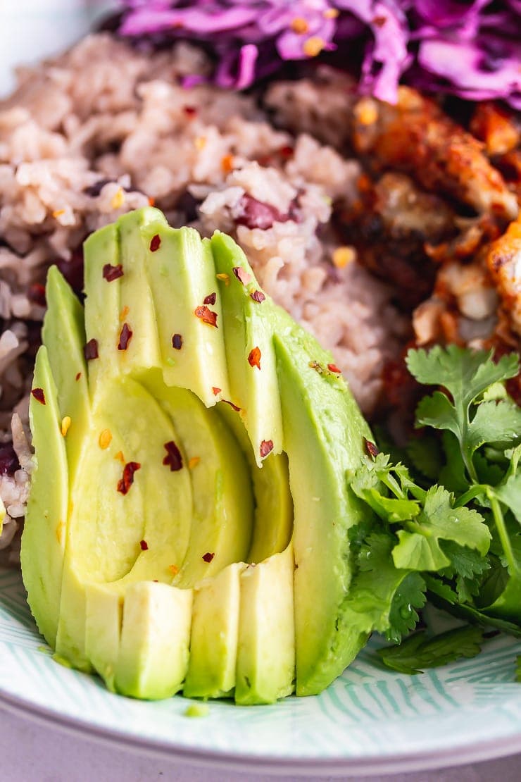 Close up of avocado on a fish taco bowl