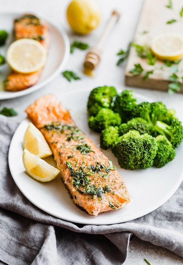 Lemon honey glazed salmon on a white plate