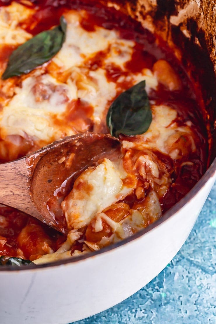 One pot gnocchi bake with a wooden spoon