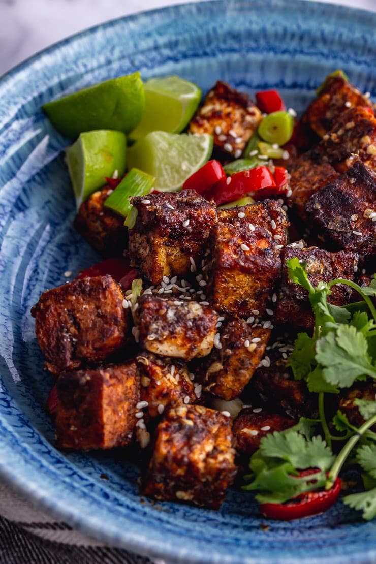 Close up of salt and pepper tofu in a blue bowl