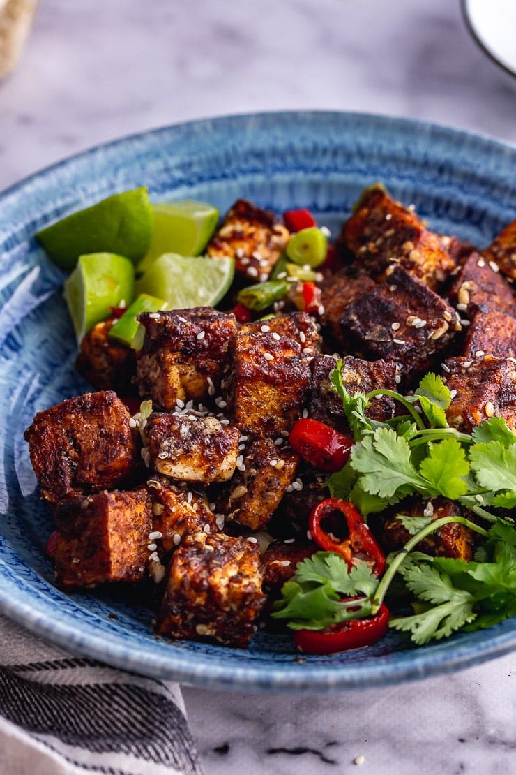 Close up of salt and pepper tofu in a blue bowl 