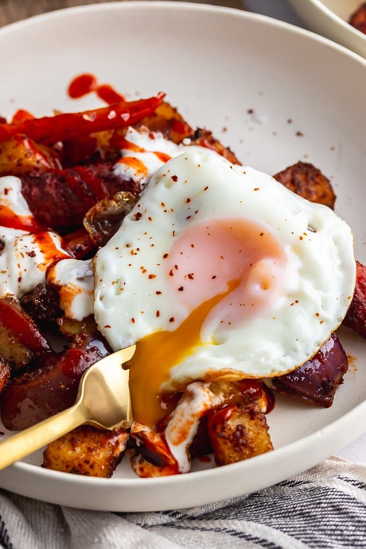 Veggie sausage bake topped with a runny fried egg