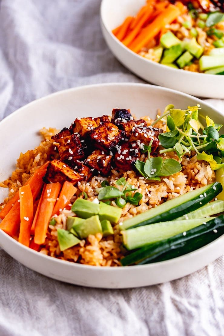 Spicy rice bowls on a cotton background