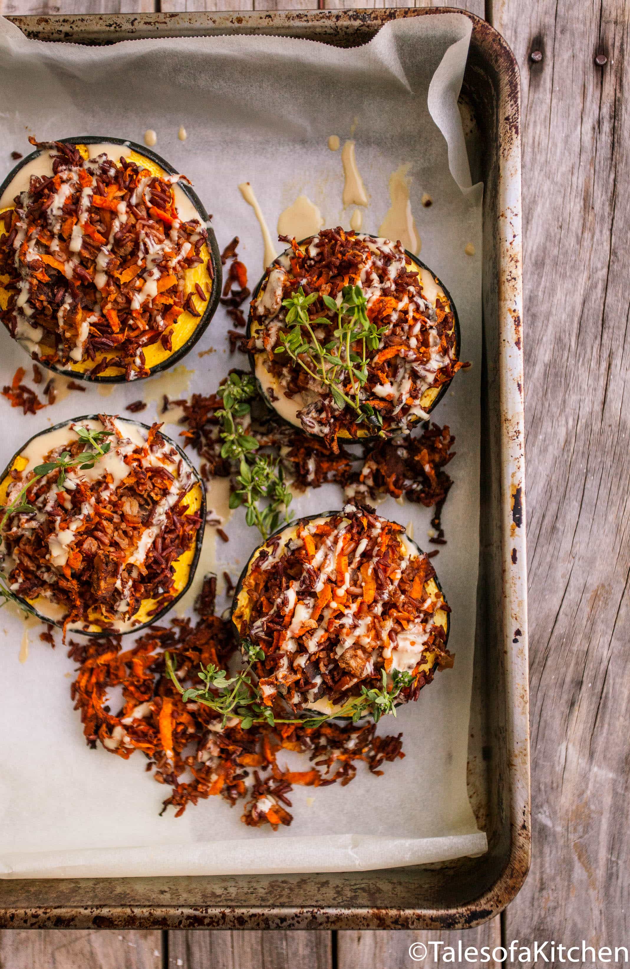 Stuffed gem squash on a baking sheet