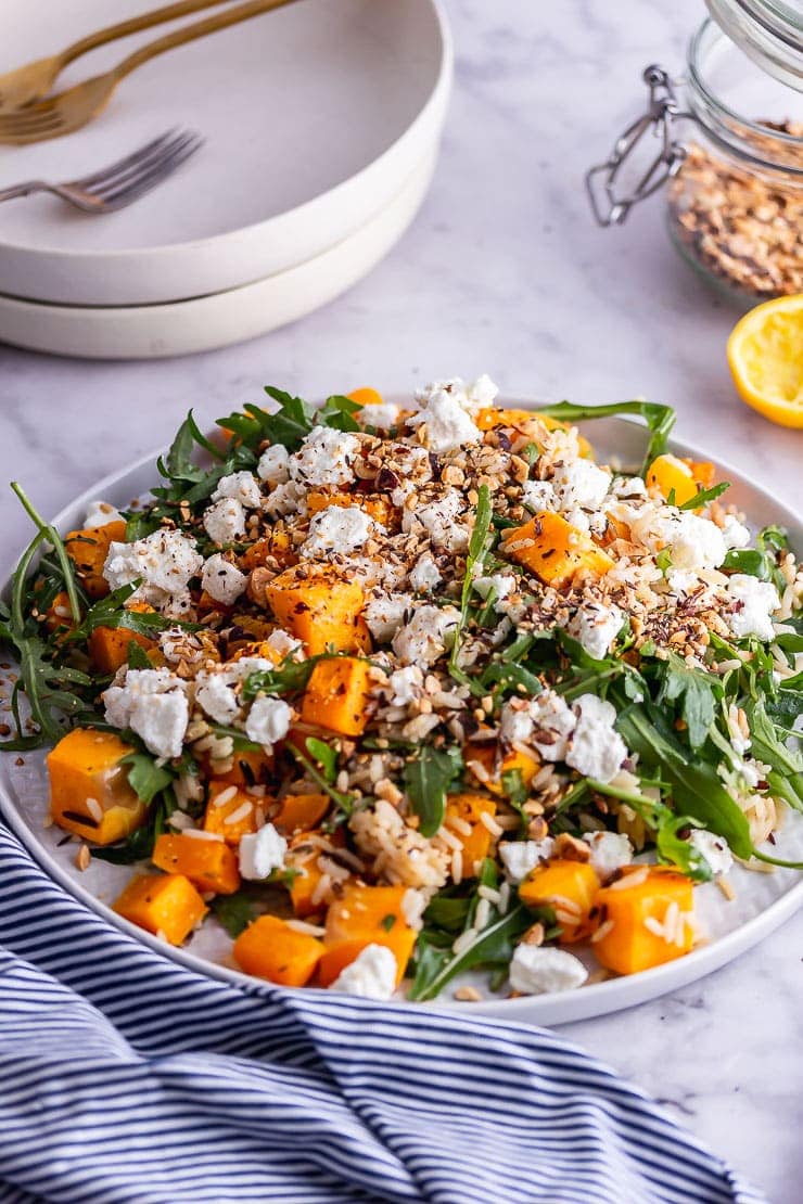 Grey plate of butternut squash salad with rocket 