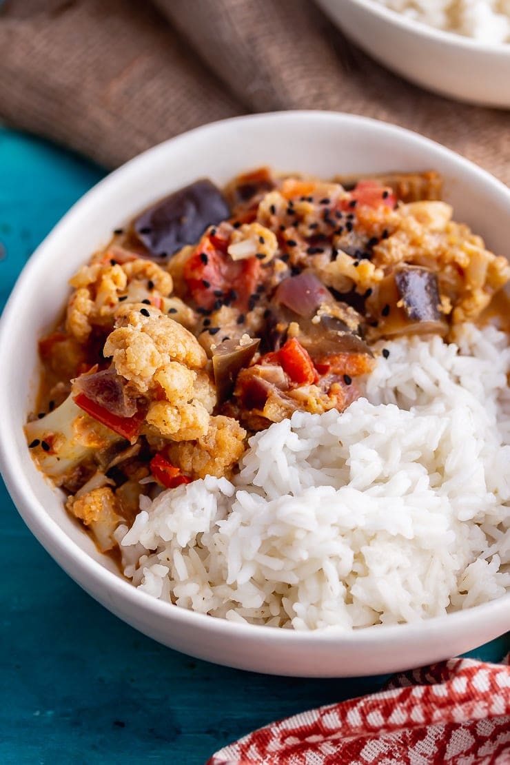 White bowl of pressure cooker vegetable curry with rice