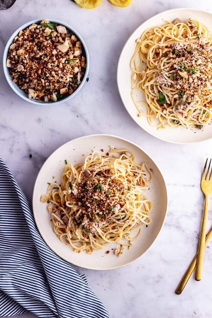 Overhead shot of two bowls of tuna pasta with pangrattato