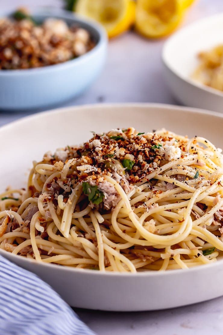 Tuna pasta with pangratatto in a white bowl 