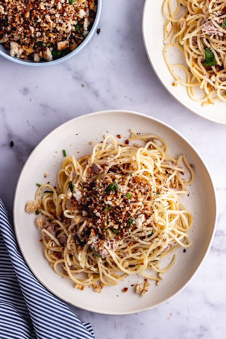 Overhead shot of tuna pasta on a marble background