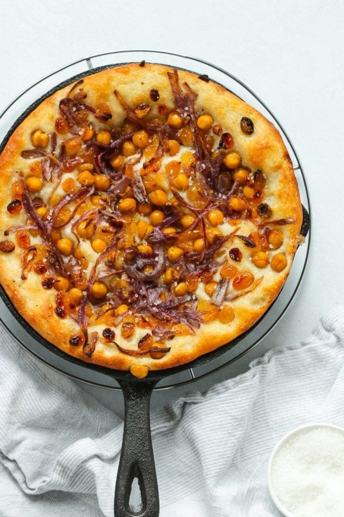 Overhead shot of chickpea focaccia in a skillet