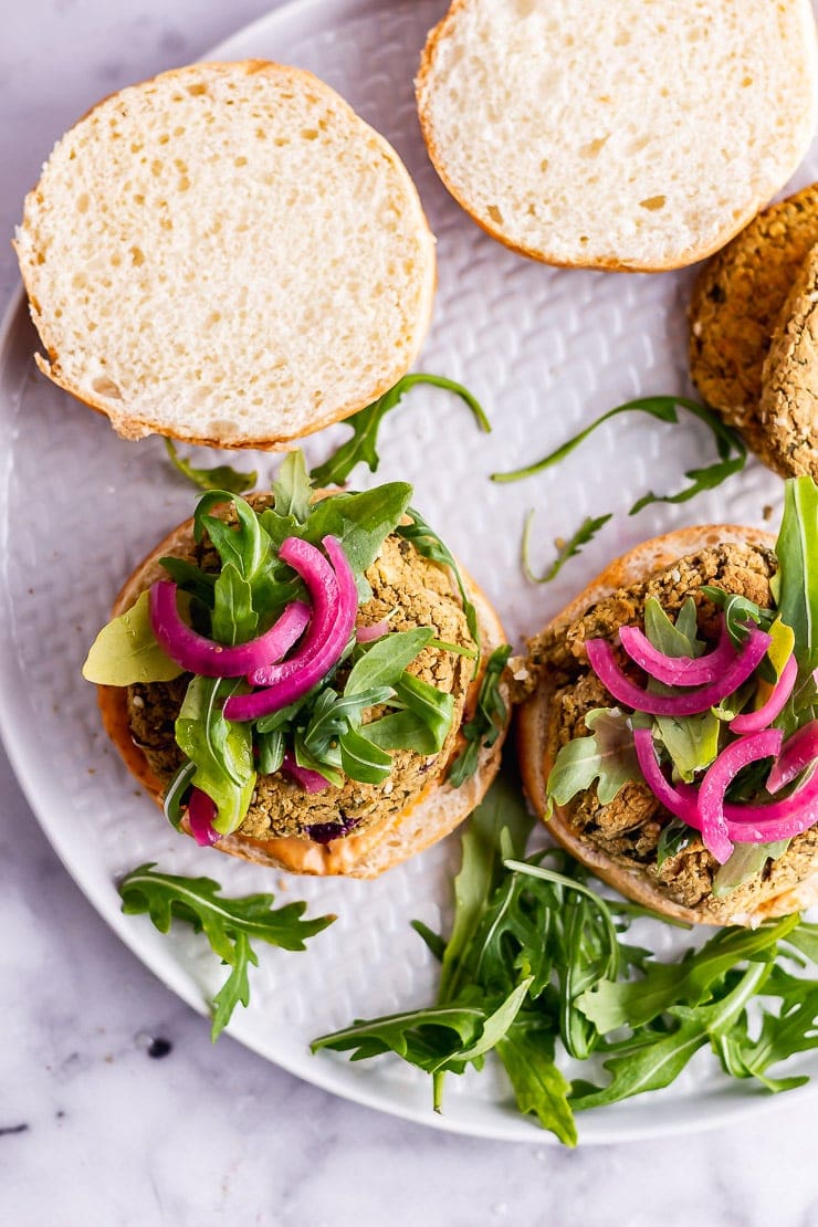 Overhead shot of baked falafel burger on a grey plate