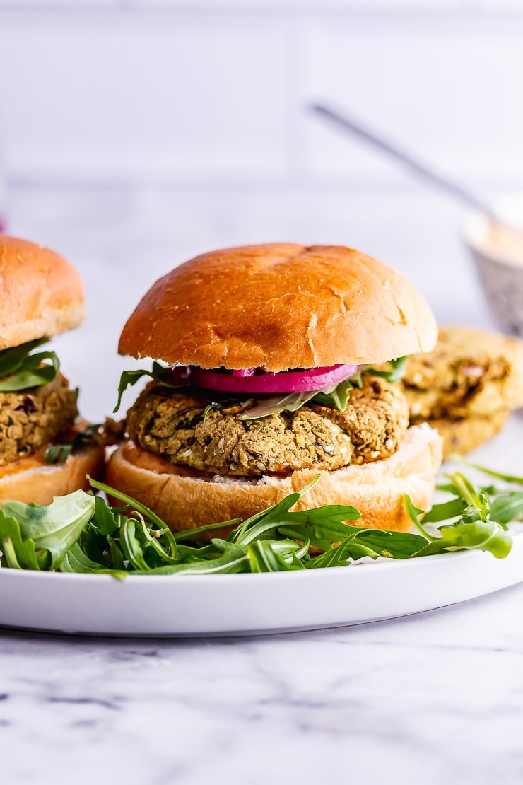 Side on shot of falafel burger on a marble surface