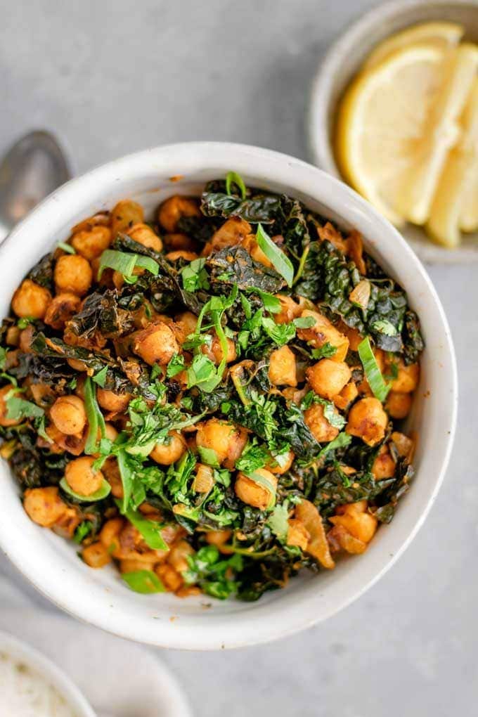 Indian Spiced Chickpeas and Greens in a white bowl