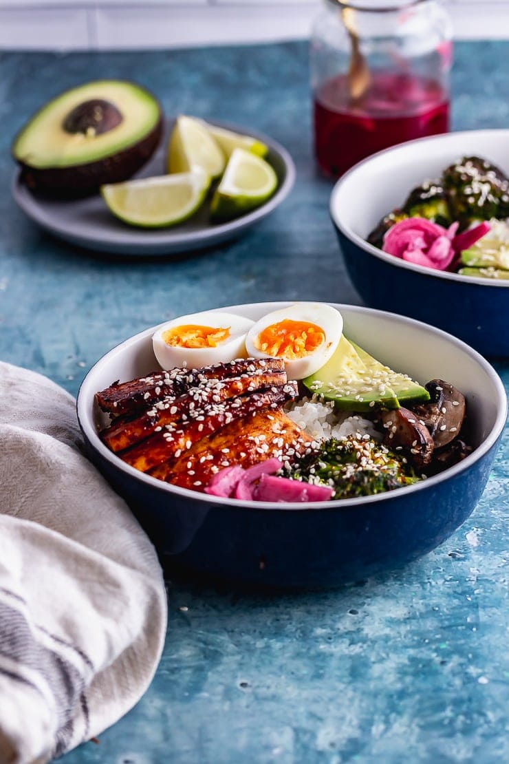 Bowls and plates of food on a blue surface