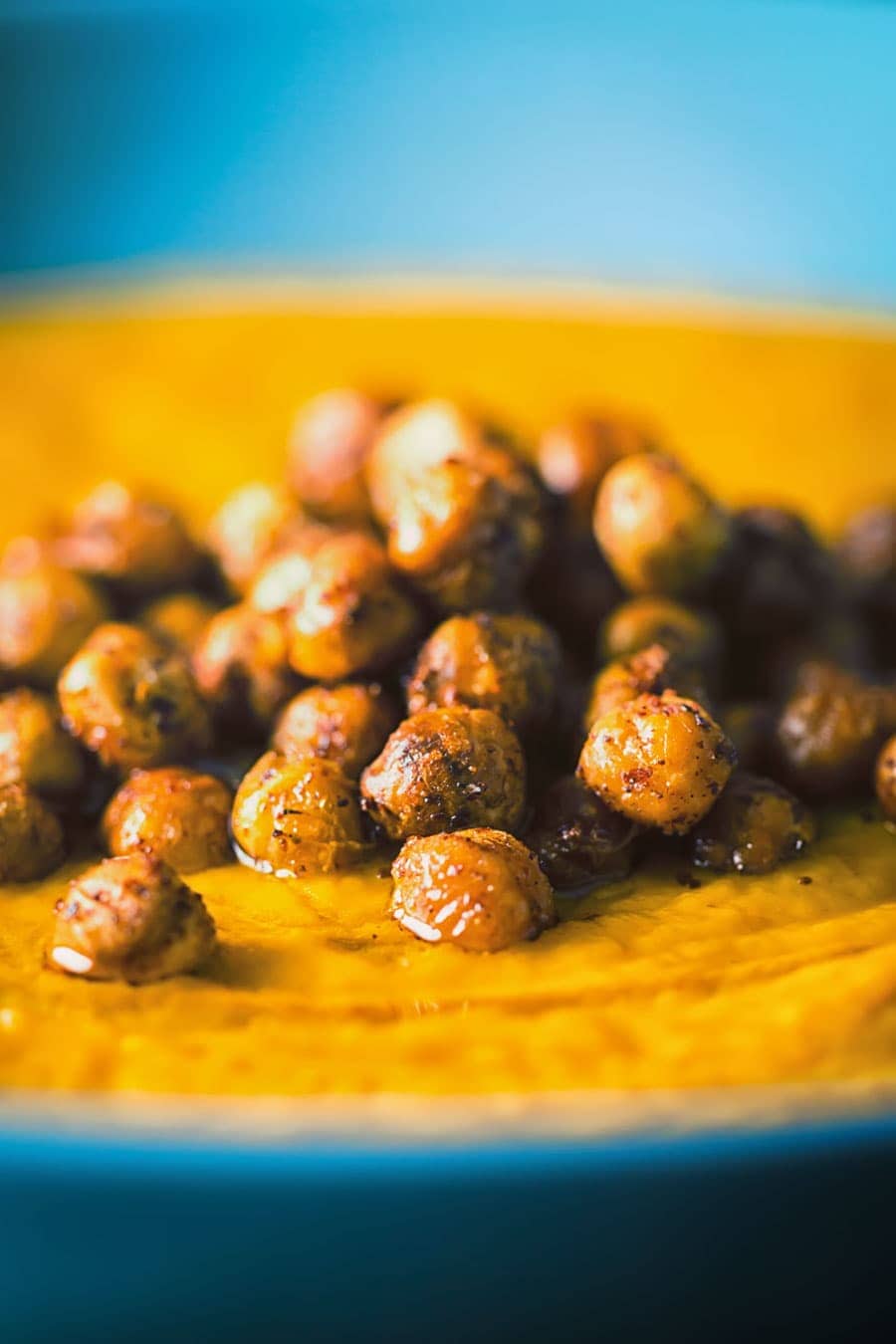 Close up of chickpeas on carrot soup