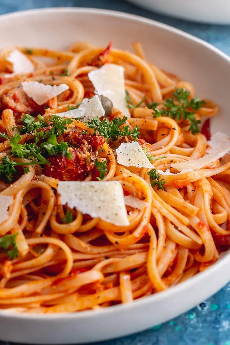 Close up of salmon linguine with parmesan and parsley