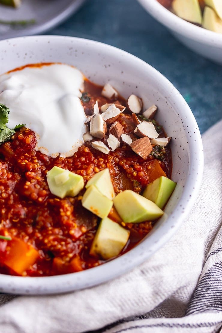 Close up of spicy veggie stew with avocado and yoghurt