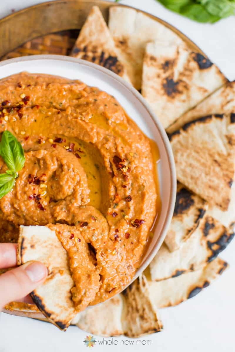 Overhead shot of pizza hummus with bread