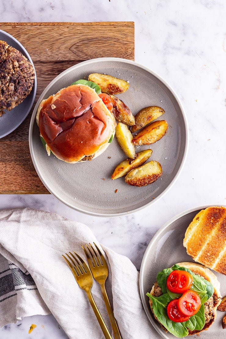 Overhead shot of mushroom burgers on a marble surface