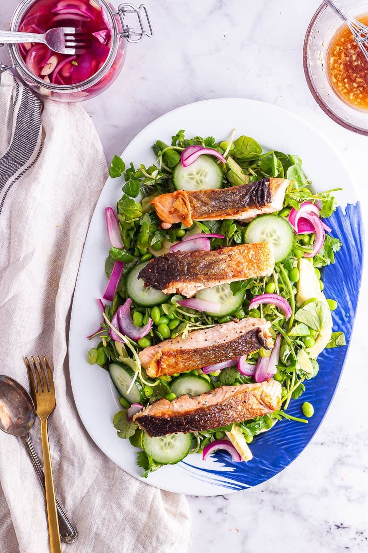 Salmon salad on a platter oven a marble background with a beige cloth