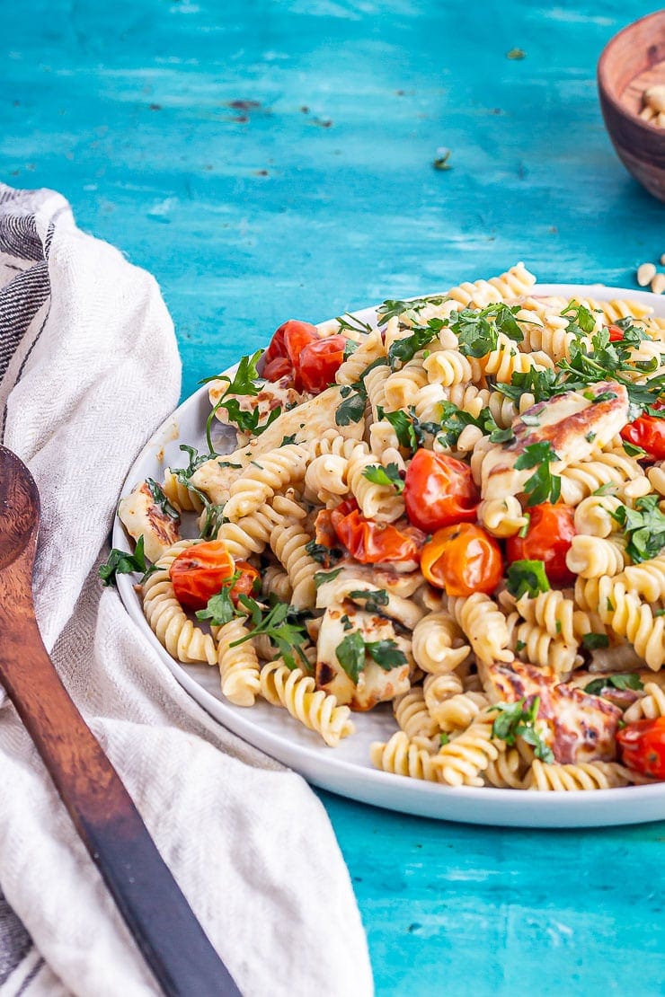 Plate of food with a wooden spoon on a cloth