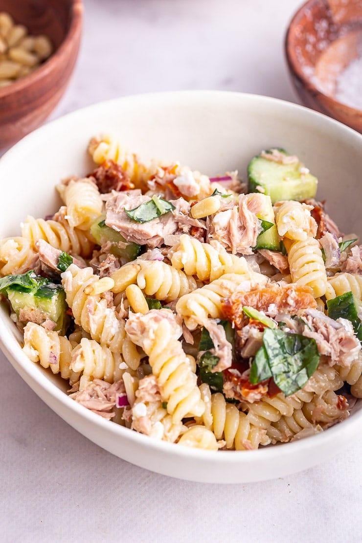 Close up of tuna pasta salad in a white bowl